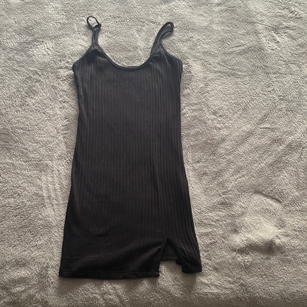 Tight fit, mini black slit dress. It’s cotton material, no holes or stains